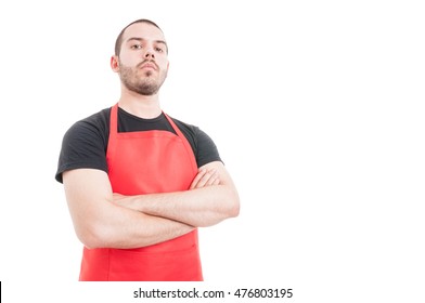 Confident butcher posing with folded arms on white background with copy space - Powered by Shutterstock