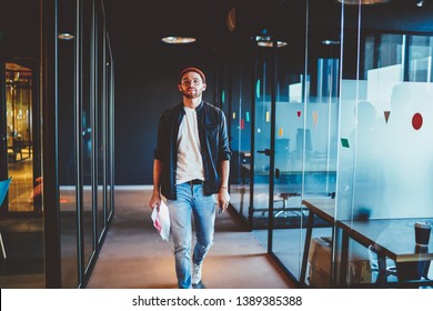 Confident Casually Dressed Businessman Walking In Modern Interior Office Thoughtfully ,serious Caucasian Guy Having Successful Career In Corporation, Full Length Of Male Hipster In Company
