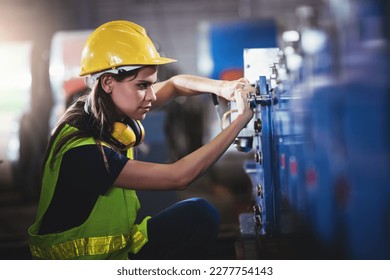 Confident caucasian engineering woman factory worker waering safety hard hat working in warehouse. - Shutterstock ID 2277754143