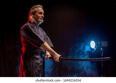 confident caucasian kendo warrior in traditional outfit use bamboo sword shinai for fighting, katana, samurai concept - Powered by Shutterstock