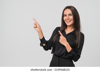 Confident caucasian young businesswoman freelancer CEO boss manager bank employee in formal wear looking at camera pointing at free copy space isolated in white background - Powered by Shutterstock