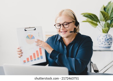 Confident Caucasian Young Student Ceo Teacher Businesswoman Tutor Consulting Clients, E-learning, Tutoring, Showing Charts Online On Laptop On Videocall Conference In Office. Remote Work