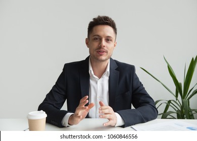 Confident CEO Looking At Camera Talking About Company Strategy And Business Plan, Explaining Corporate Success. Young Entrepreneur Shooting For Online Webinar, Recording Video Blog. Headshot Portrait