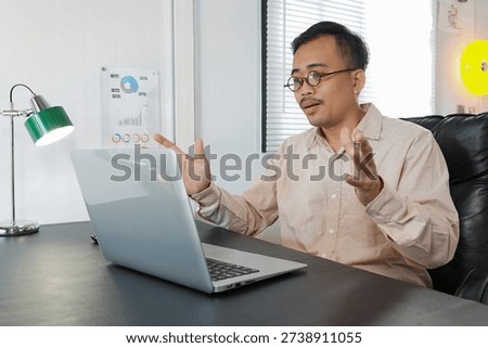 Confident CEO looking at camera talking about company strategy and business plan.
