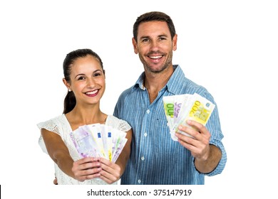 Confident couple holding money on white screen - Shutterstock ID 375147919