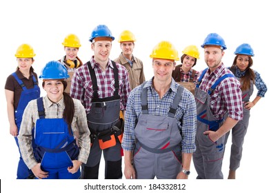 Confident diverse team of workmen and women standing grouped in their dungarees and hardhats smiling at the camera  high angle view isolated on white
