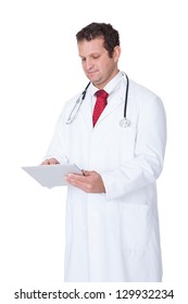 Confident doctor using digital tablet. Isolated on white background