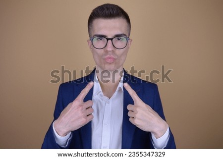 Confident and Elegant Handsome Man Pointing at Himself with Self-Assuredness on Isolated Background