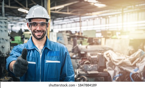 Confident engineer in blue jumpsuit with hard hat thumbs up in the warehouse.	
 - Powered by Shutterstock