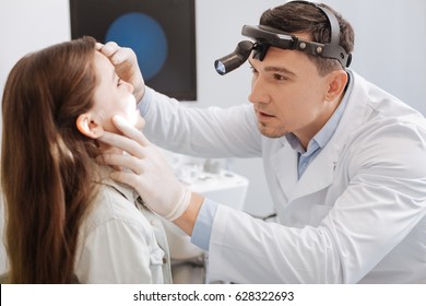 Confident ENT Doctor Doing Throat Exam