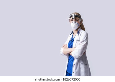 Confident ENT Doctor Surgical Headlight Head Light. Portrait Of Female Otolaryngologist Or Head And Neck Surgeon On Light Grey Background.