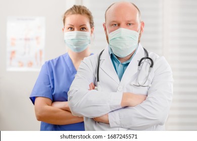 Confident And Exhausted Doctor And Nurse With Arms Crossed In Hostpital