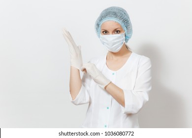 Confident experienced young doctor woman with face mask, sterile hat, gloves isolated on white background. Female surgeon doctor in medical gown. Healthcare personnel, health, medicine concept - Powered by Shutterstock