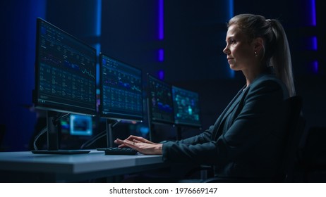 Confident Female Data Scientist Works on Personal Computer in Big Infrastructure Control Room. Stock Market Woman Specialist Uses Computer Showing Graphs, Charts, Information. Monitoring Room Team - Powered by Shutterstock - Get 15% off with code: PIKWIZARD15