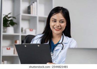 Confident Female Doctor in White Coat with Stethoscope Reviewing Patient Chart in Modern Medical Office - Powered by Shutterstock