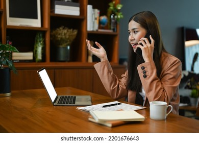 Confident Female Financial Advisor Having Phone Conversation, Negotiations With Client