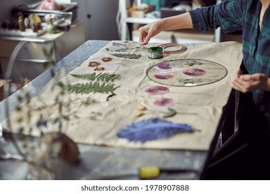 Confident Female Florist Is Working With Dryed Flowers In Cozy Flower Shop