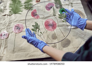 Confident Female Florist Is Working With Dryed Flowers In Cozy Flower Shop