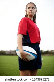 Confident Female Rugby Player On The Field