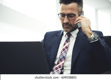 Confident Handsome Mature Business Man Having Phone Conversation With Partners Discussing Contract, Experienced Manager Or Corporation In Formal Wear Doing Remote Job Using Modern Technologies