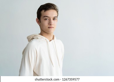 Confident Handsome Teen Boy Looking At Camera. Young Man. Teen Boy Portrait Concept. Isolated View On White Background.