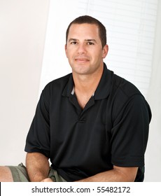 Confident, Happy, Healthy Man Around 30 Years Old. Vertical Portrait, Casual Dress.