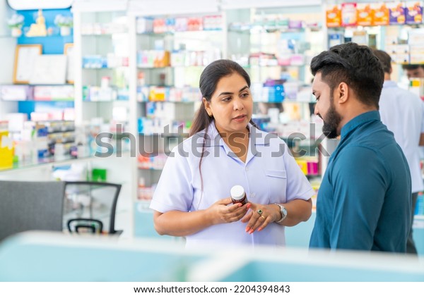 Confident Indian Woman Pharmacist Medication Recommendation Stock Photo ...