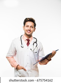 Confident Indian/Asian young Male Doctor with stethoscope and Medical Chart, standing isolated over white background