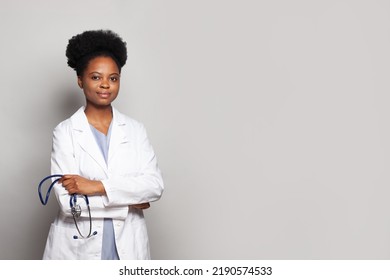 Confident kind doctor woman with stethoscope on white background - Powered by Shutterstock