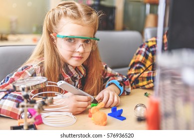 Confident Little Inventor In Workshop