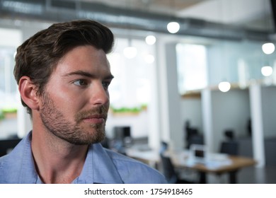 Confident Male Executive Looking Away In The Office