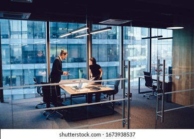 Confident male and female colleagues discussing project organization and planning looking at sketch on table together,prosperous employes in formal wear having meeting communication and analyzing - Shutterstock ID 1673938537