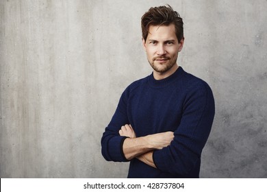 Confident Man In Blue Sweater, Portrait