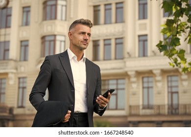 Confident Man Formal Outfit. Modern Life Concept. Businessman On Way To Office. Agile Business. Use Phone While Walking. Urban Style And Everyday Life. Ordinary Working Day. Charismatic Man In Suit.