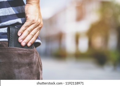 Confident Man Keeping Wallet In The Back Pocket Of His Back Pocket Pants. Savings Money.	