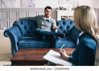 Confident Man At The Psychologist. Consultation With A Specialist In A Psychiatric Office.