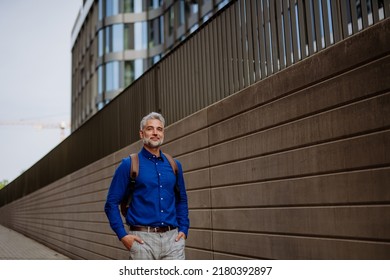 Confident Man Wearing Backpack Walking In Street, Businessman In Casual Clothes In Summer On The Way To Work.