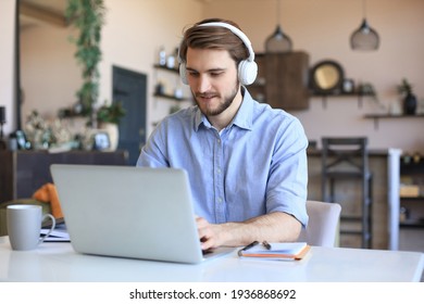 Confident Man Wearing Headset Speaking And Watching Business Webinar Training, Listening To Lecture