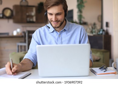 Confident Man Wearing Headset Speaking And Watching Business Webinar Training, Listening To Lecture