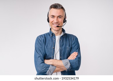 Confident mature man with it support headset and arms crossed isolated over white background - Powered by Shutterstock