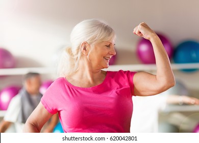 Confident Mature Woman Showing Off Her Bicep
