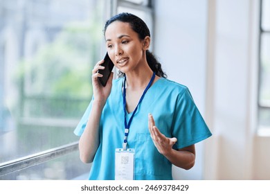 Confident Medical Professional in Scrubs Discussing on Phone in Hospital Corridor - Powered by Shutterstock