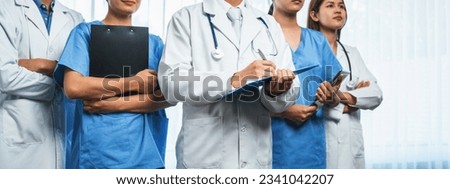 Confident medical staff team with doctor nurse and healthcare specialist professions people in hospital or clinic office. Medical and healthcare community in panoramic banner. Neoteric