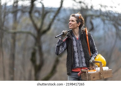 Confident Mid Adult Female Fruit Grower Walking Home After A Day In The Orchard