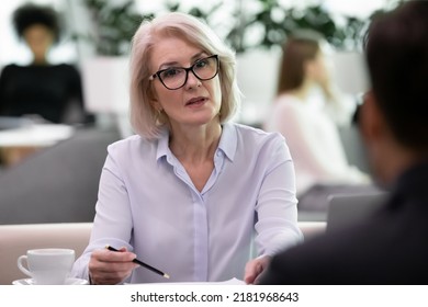 Confident Middle-aged Female Boss Or CEO Have Meeting With Business Client Or Partner In Office. Successful Mature Businesswoman Talk Speak With Candidate Or Applicant At Job Interview. HR Concept.