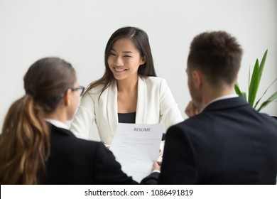 Confident Millennial Asian Applicant Smiling At Job Interview, Happy Beautiful Chinese Candidate Or Self-assured Seeker Being Interviewed By Hr Managers, Good Performance And First Impression Concept