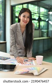 Confident Millennial Woman Standing At Her Creative Office And Smiling To Camera