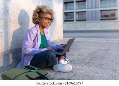 Confident Modern Business African American Woman With Laptop Outside The Office In The City. Creative Professional Freelancer Working Outside.