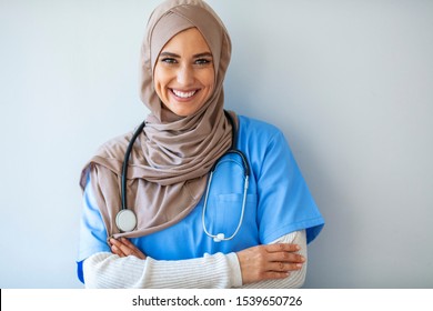 Confident Muslim Female Doctor Standing Inside Hospital. Portrait Of Muslim Doctor With Stethoscope. Confident Muslim Medical Student Pose At Hospital. Confident Muslim Doctor