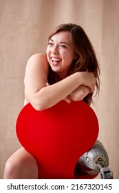 Confident Natural Body Positive Woman With Prosthetic Limb In Underwear Sitting On Chair